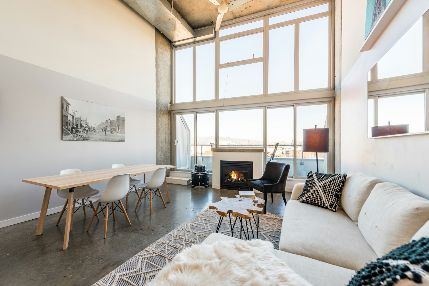 Double-height great room with the original concrete structure left exposed