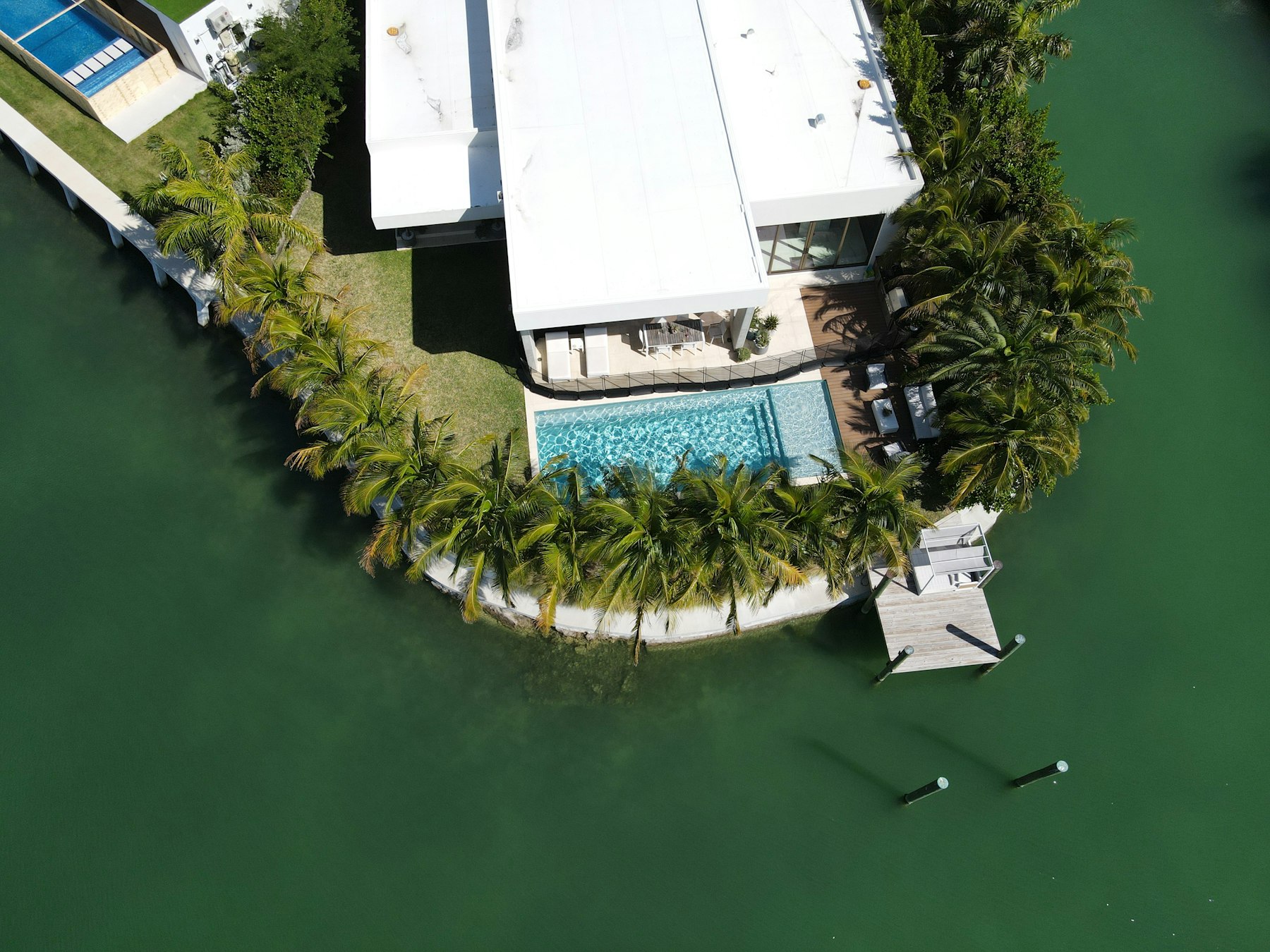 Heated saltwater pool under a full cage