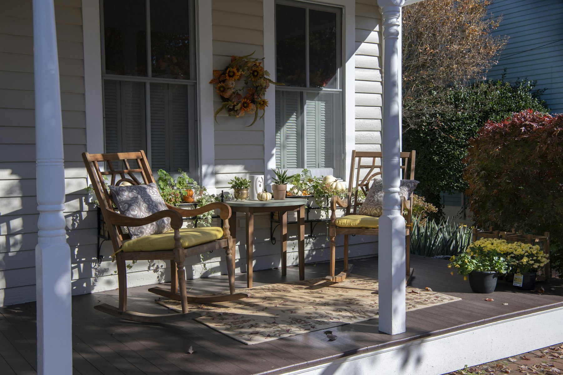 The Bay Street Bungalow from the sidewalk, a 1940s cottage with a deep front porch