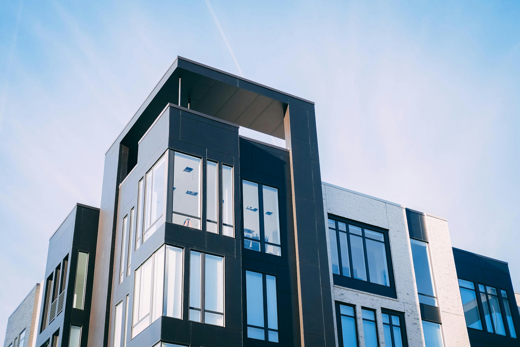 The Rosemary Loft building from Central Avenue, a low modern facade with black steel windows